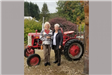Two Women in Front of a Small Tractor