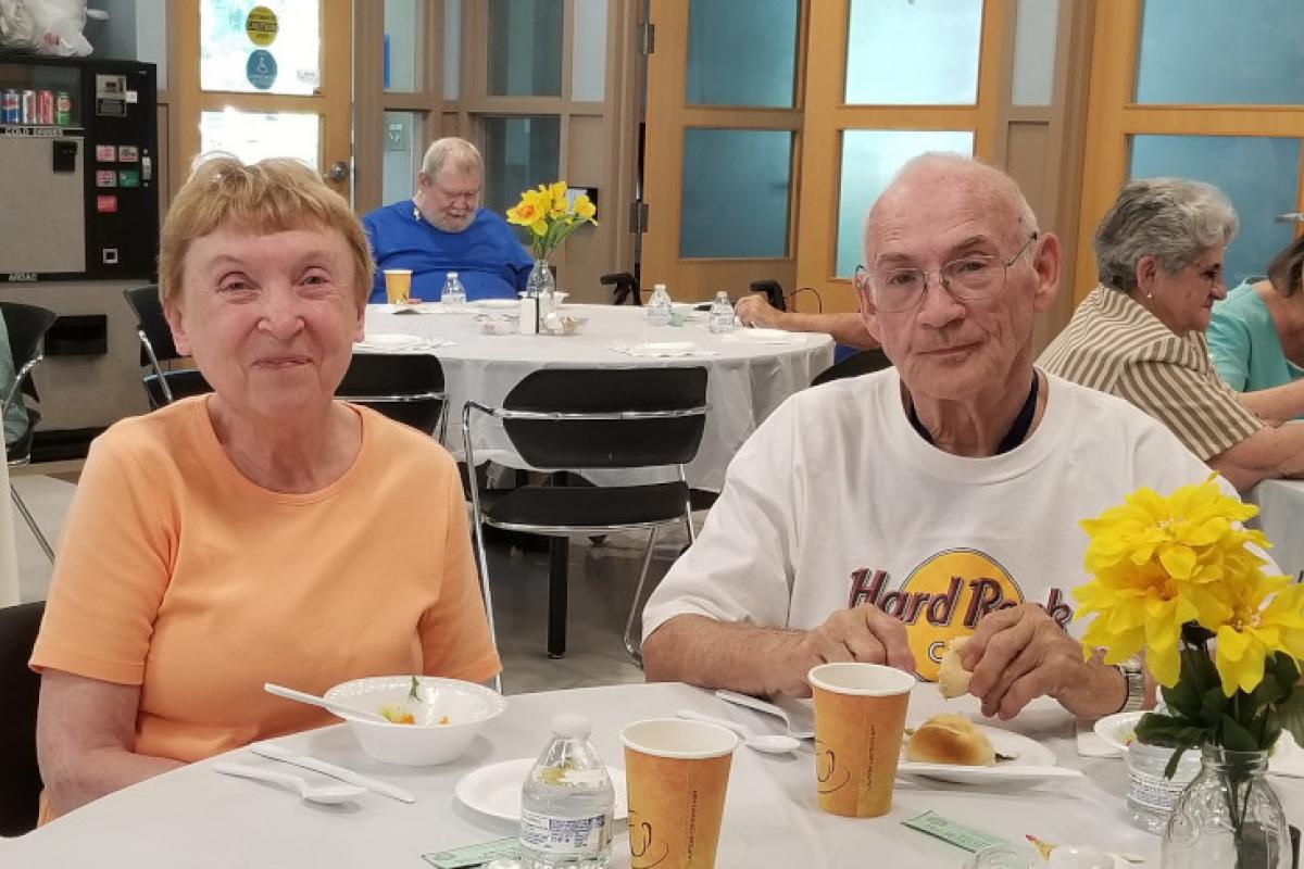 People Seated at Table Eating 10