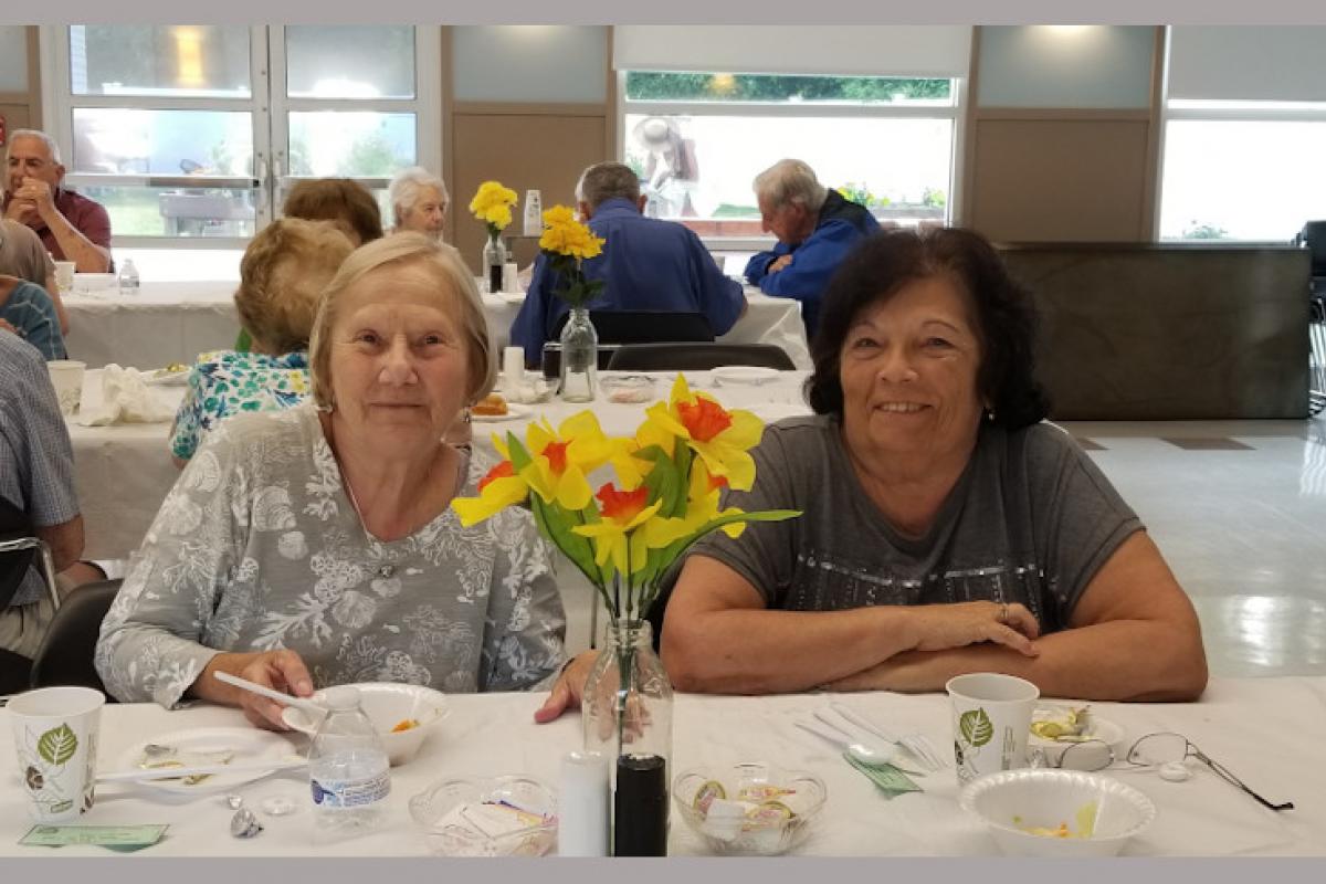People Seated at Table Eating 9