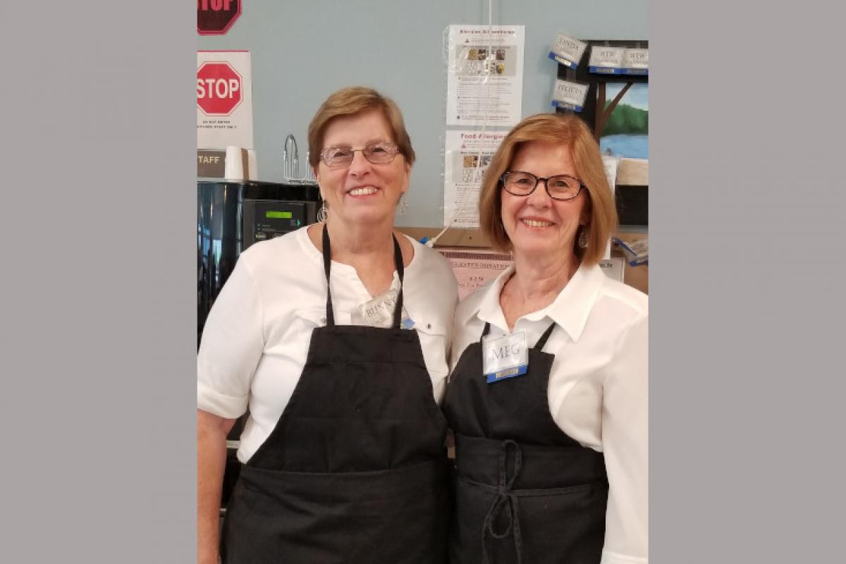 Staff Members Serving Guests 1