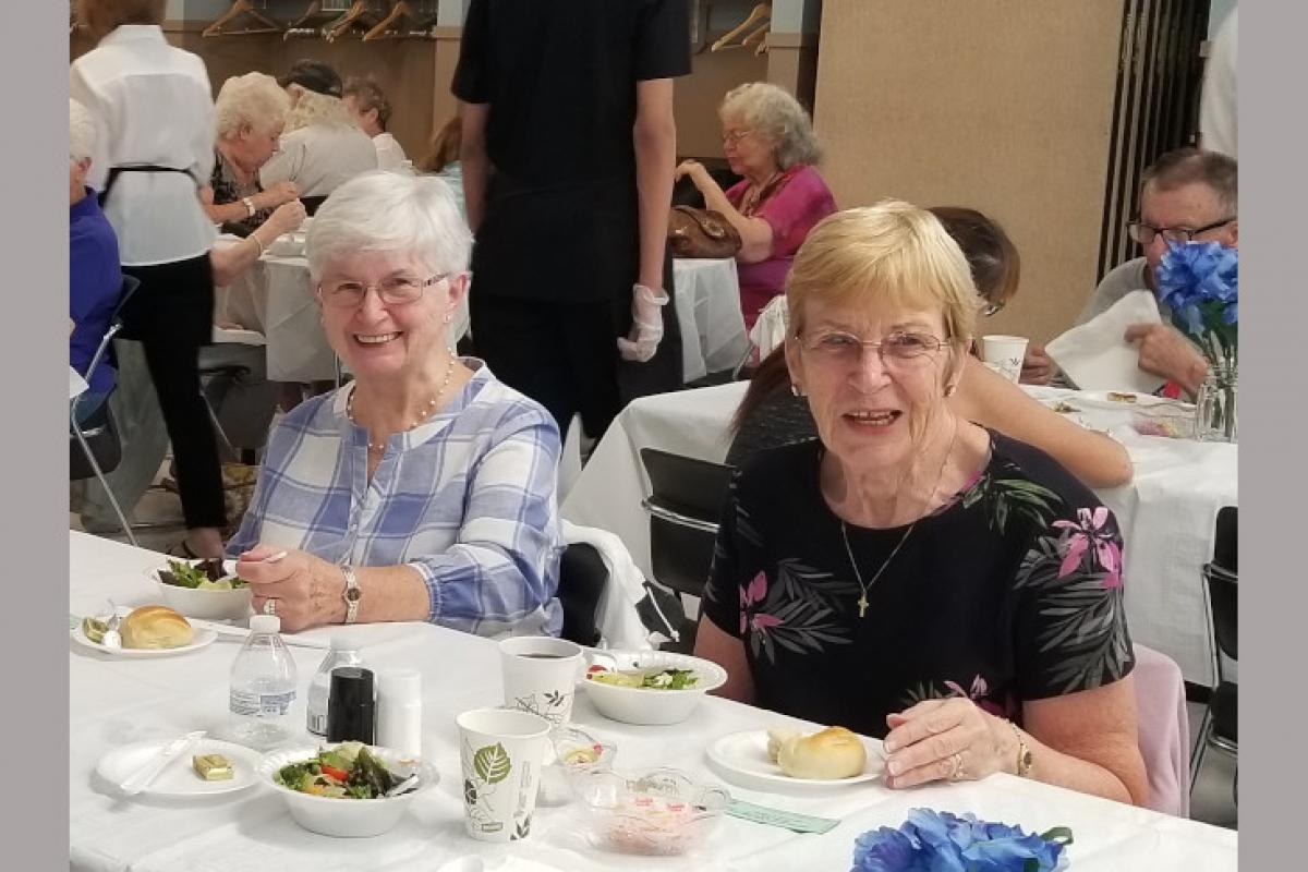 People Seated at Table Eating 7