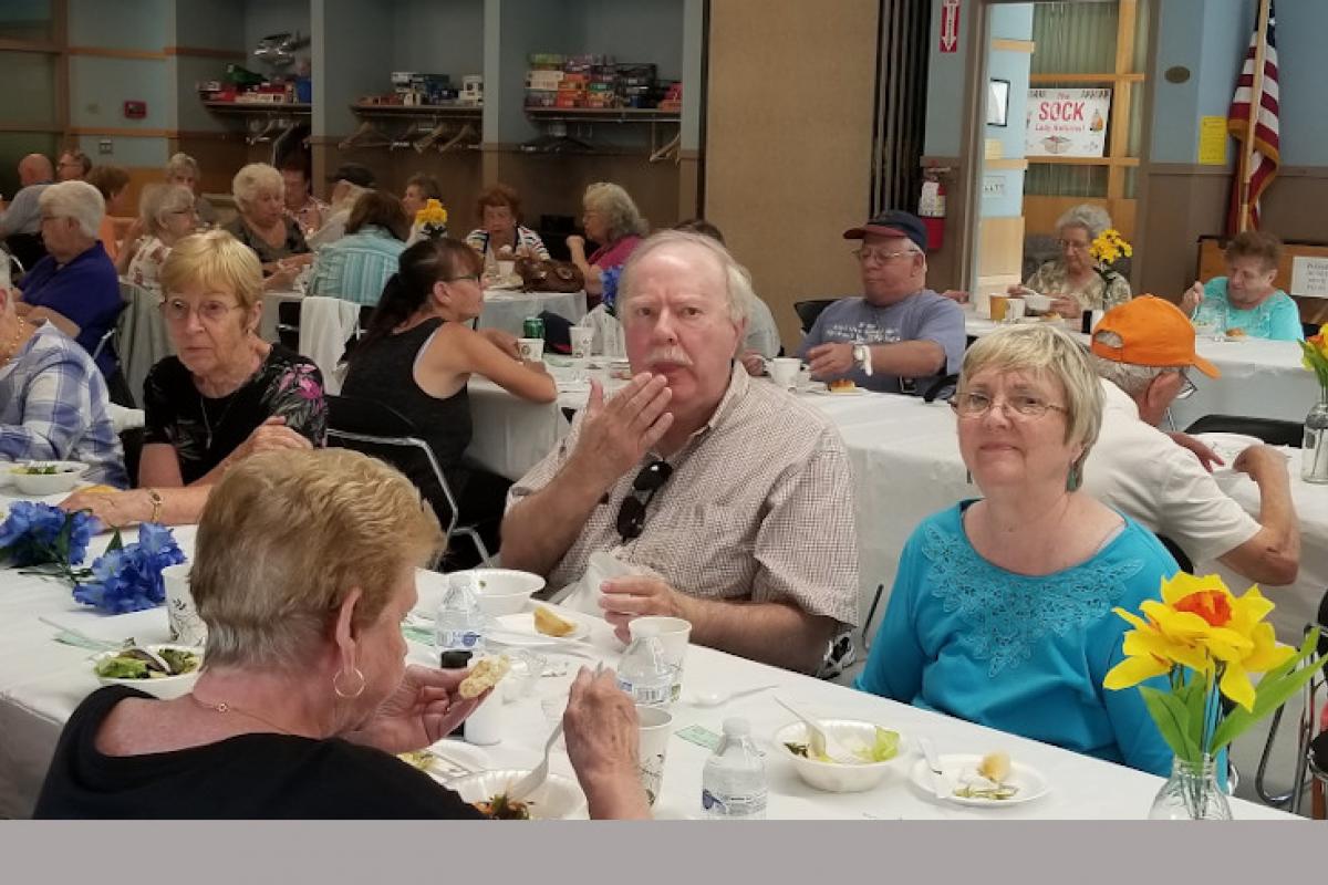 People Seated at Table Eating 6