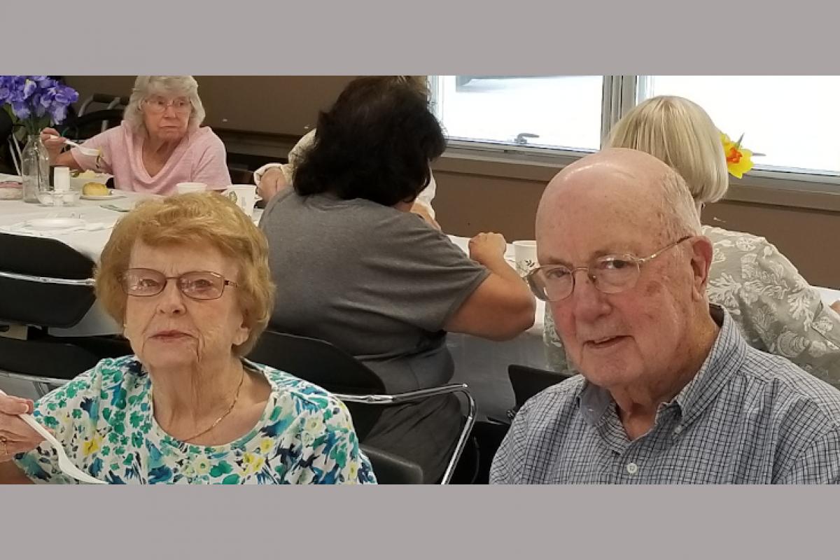 People Seated at Table Eating 3