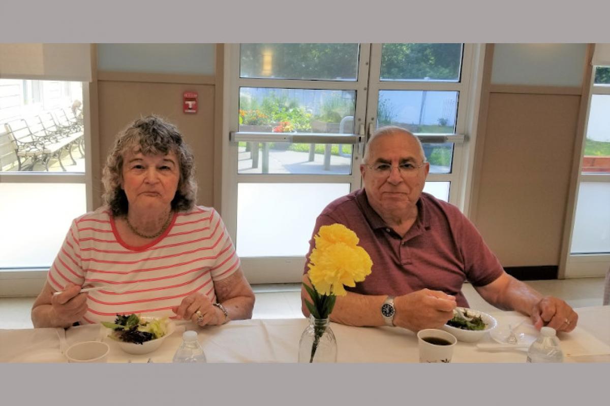 People Seated at Table Eating 2