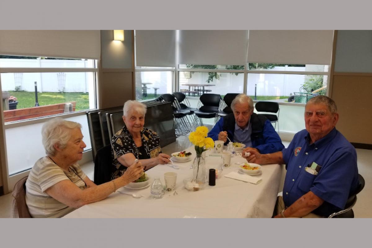 People Seated at Table Eating 1