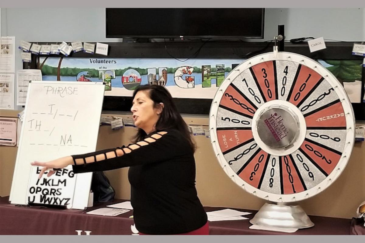 Person Hosting Wheel of Fortune Game 1