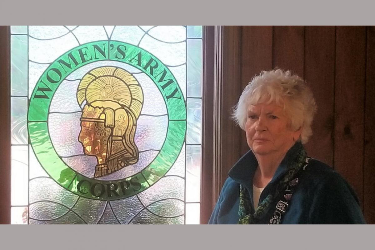 Woman Next to Women's Army Corps Door