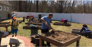 Community Garden Volunteers outside gardening.