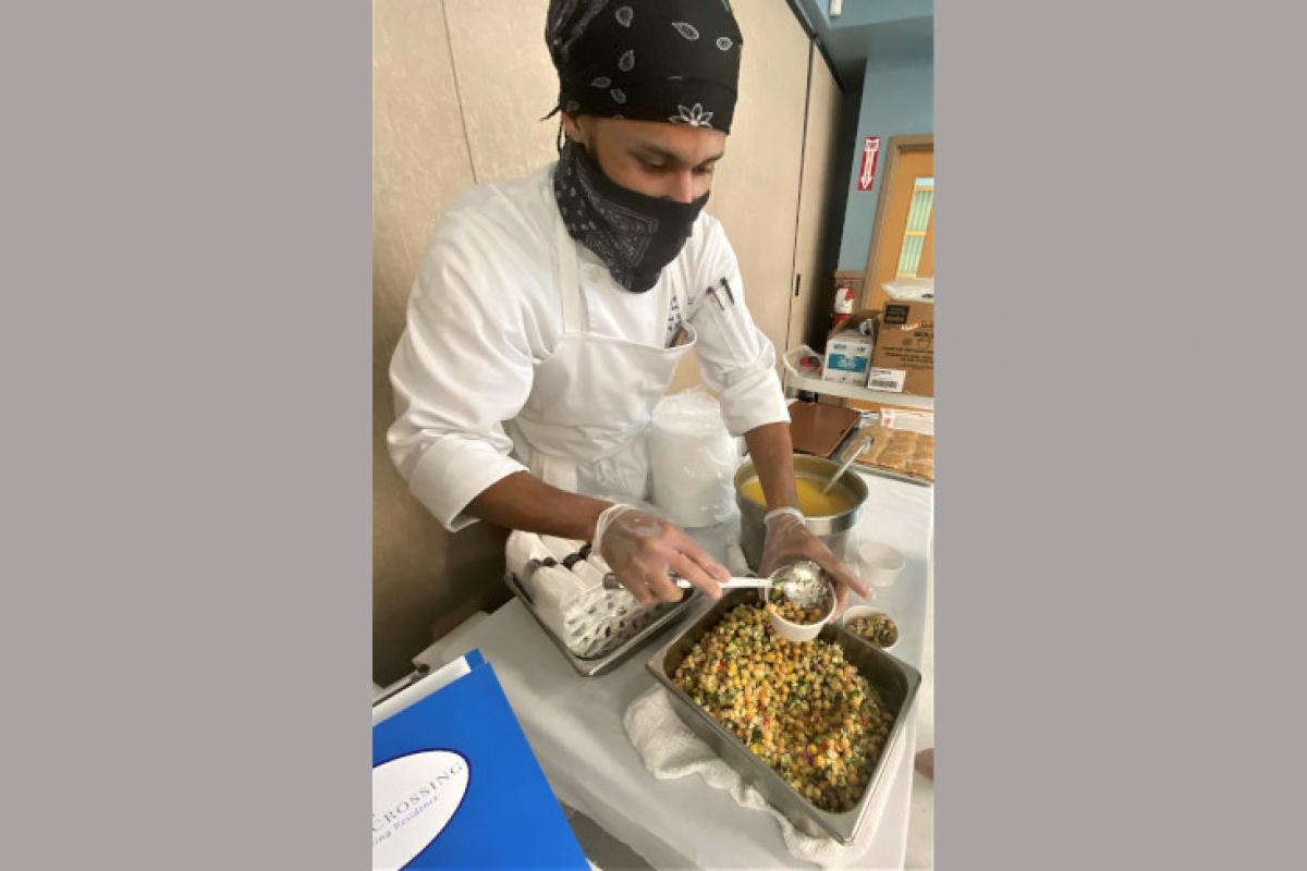 Person Dishing Up Food