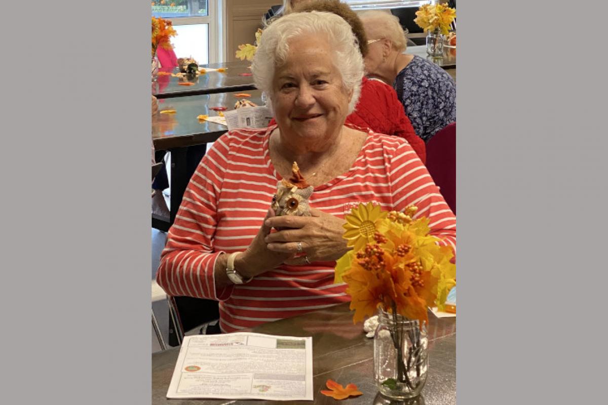 Woman Holding Stuffed Owl Toy