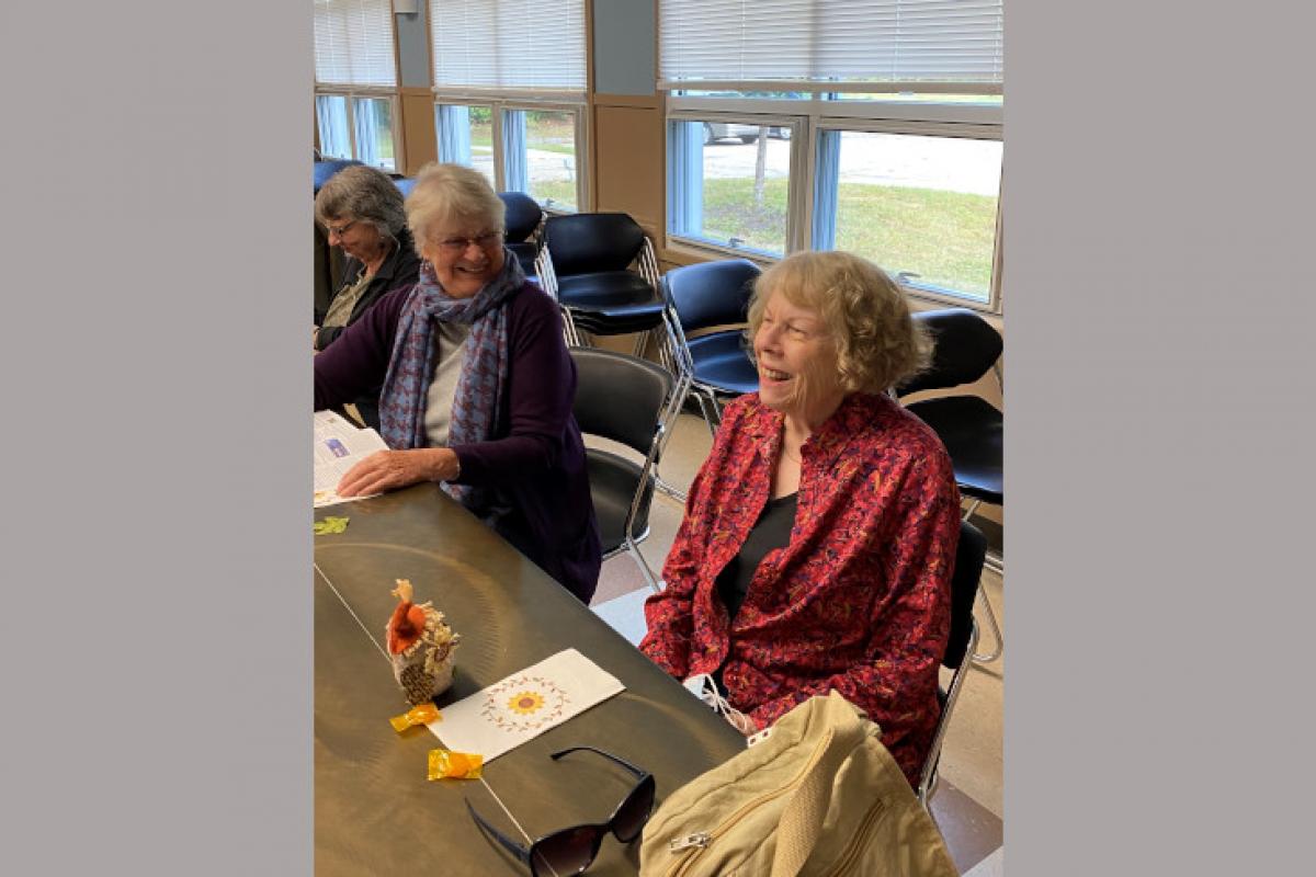 Women Talking and Laughing at Table
