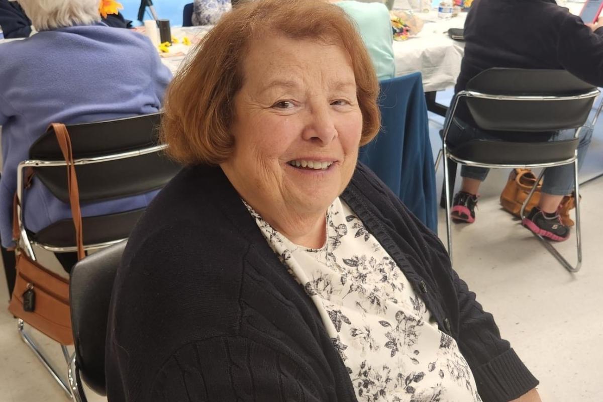 Woman Seated Smiling