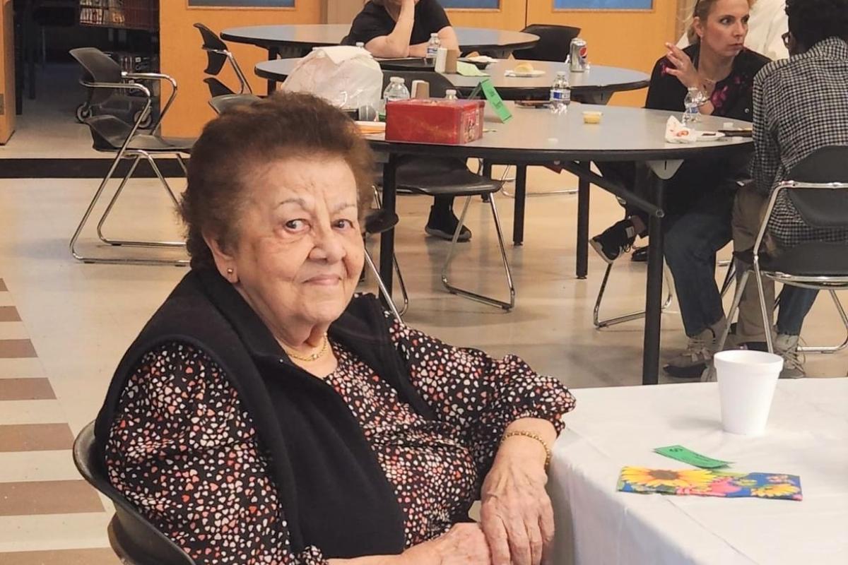 Woman Seated at End of Table