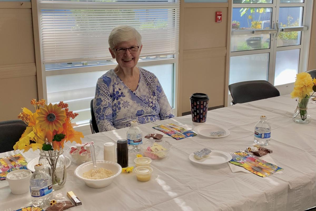Woman Seated at Table