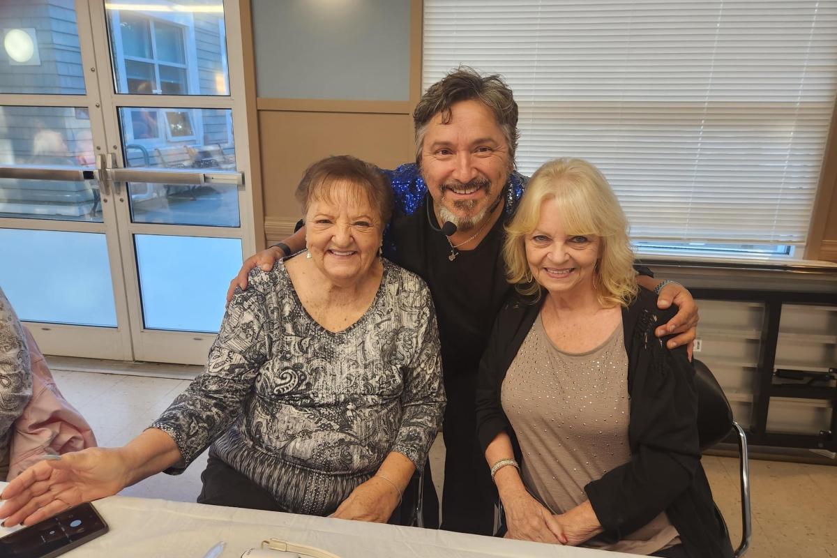 Singer Posing for Photo with Attendees