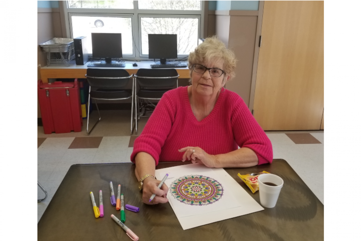 Woman Taking a Break from Coloring