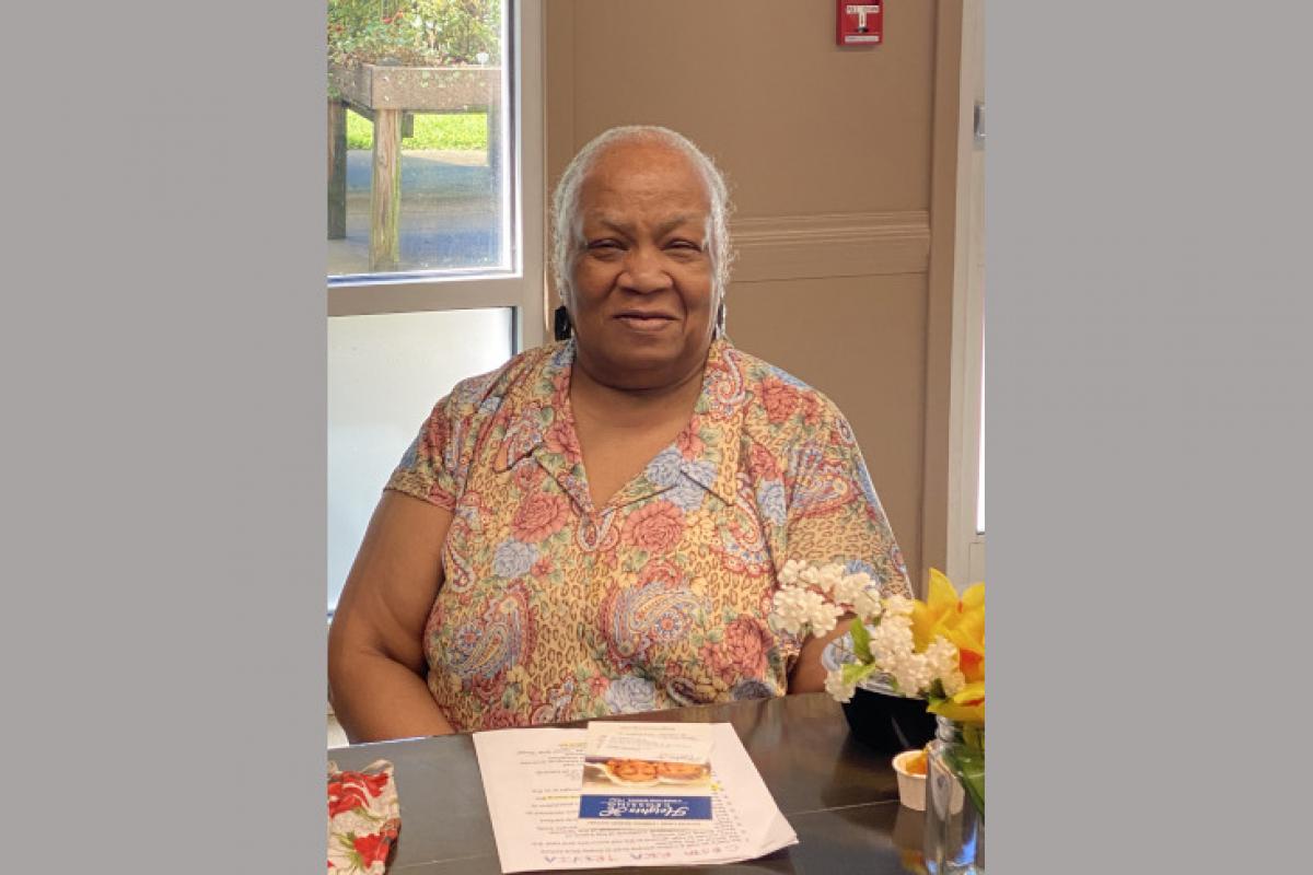 Woman Seated Smiling