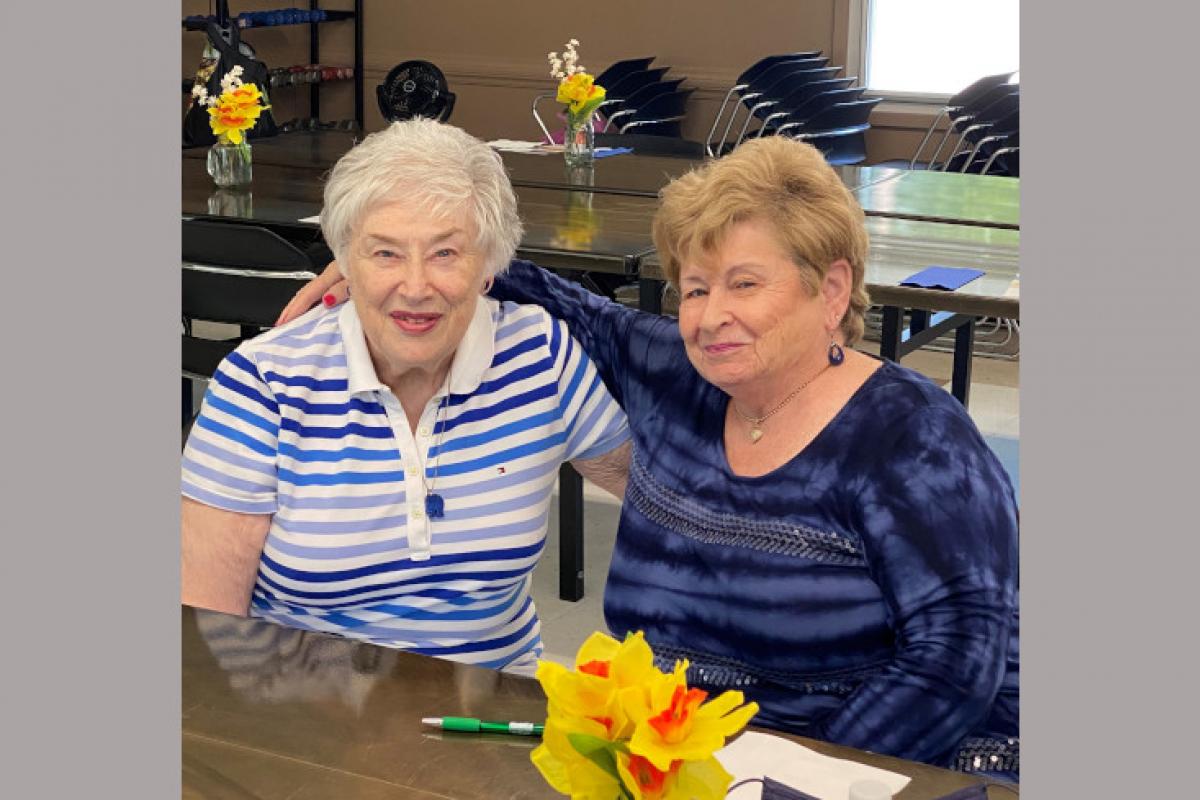 Two Women Arm in Arm