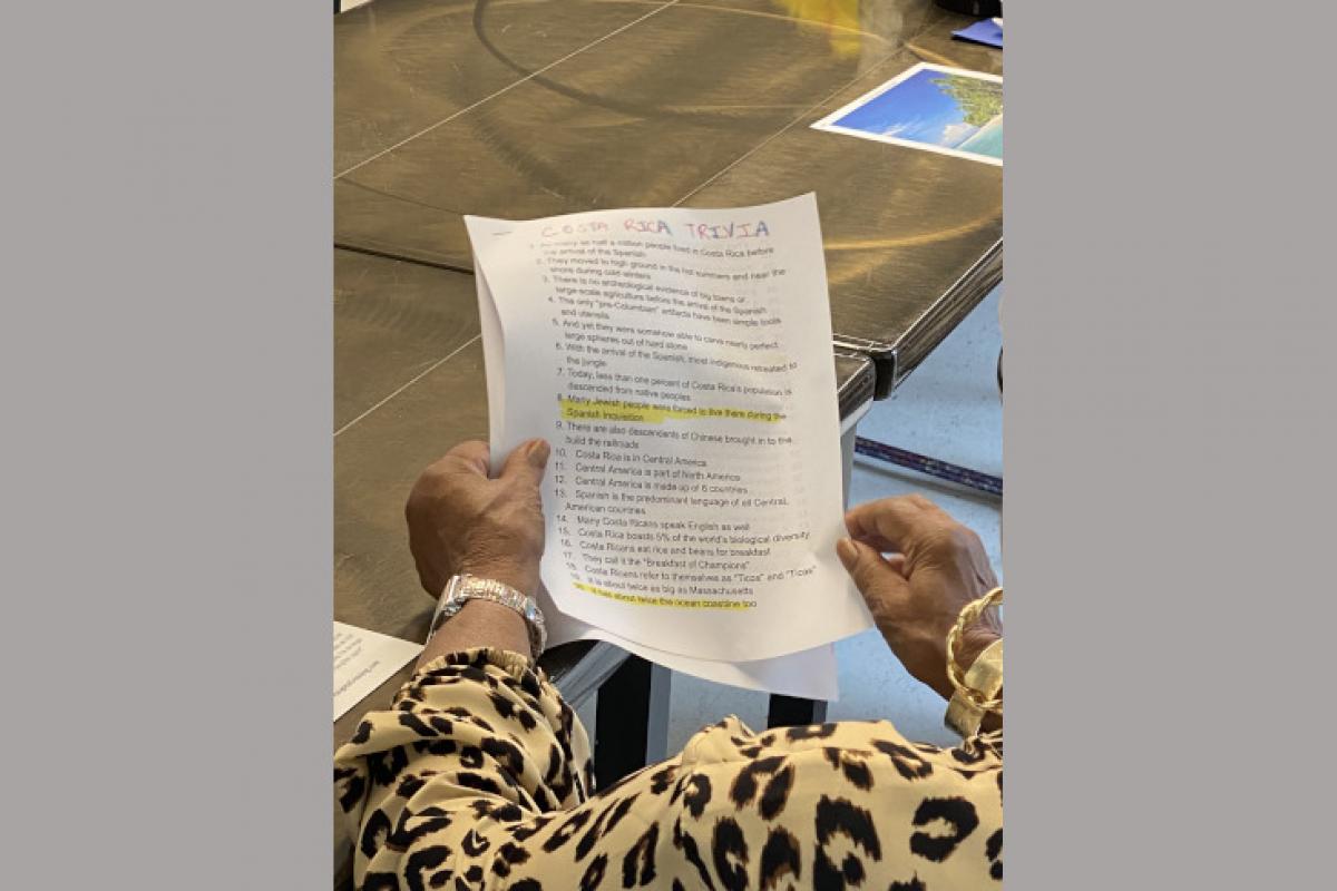 Person Holding Trivia Sheet