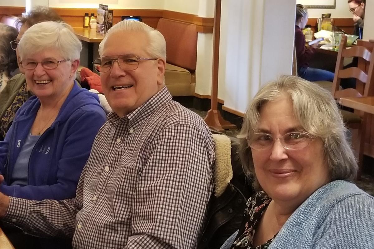 Three People Smiling