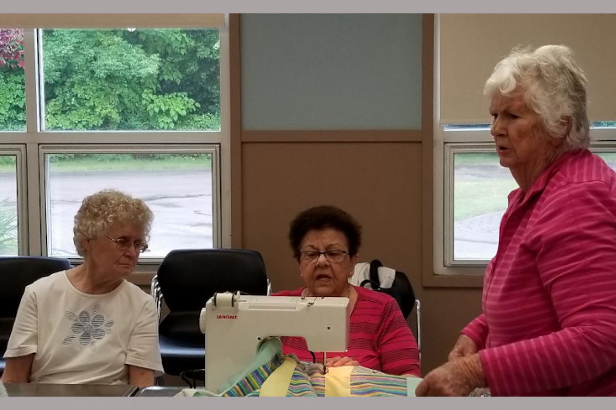 Women Using Sewing Machine