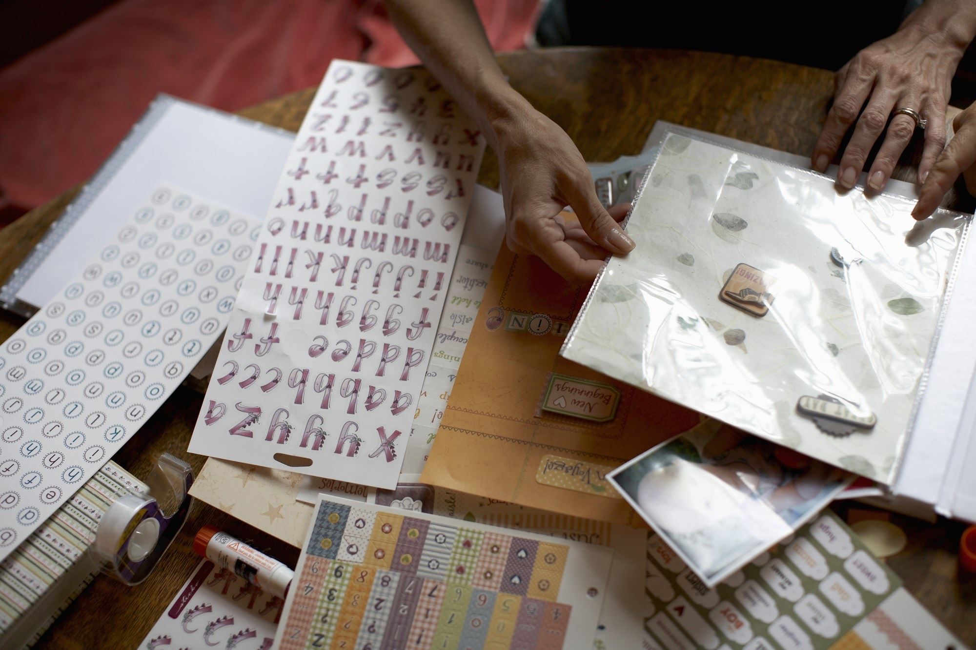 Photo of a person with a table full of scrapbooking supplies
